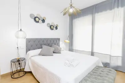 Cama o camas de una habitación en Expoholidays - Primera línea de playa Villapepita PARKING gratis