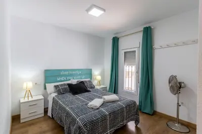 Cama o camas de una habitación en NEPTUNITO: Primera línea con Piscina