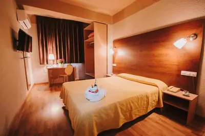 Cama o camas de una habitación en Hotel Embajador