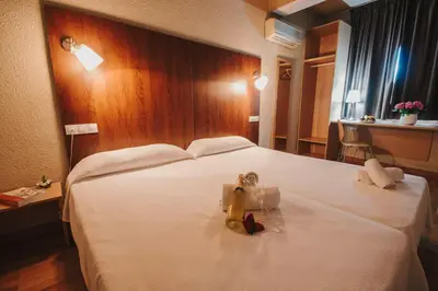 Cama o camas de una habitación en Hotel Embajador