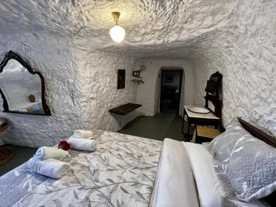 Cama o camas de una habitación en Cuevas La Veranda