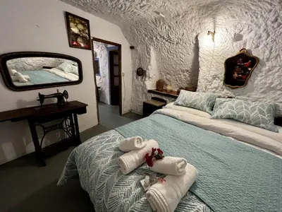 Cama o camas de una habitación en Cuevas La Veranda
