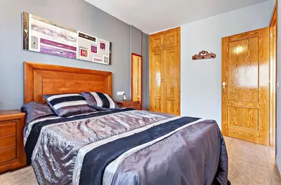 Cama o camas de una habitación en Mar Brasilia Apartamento