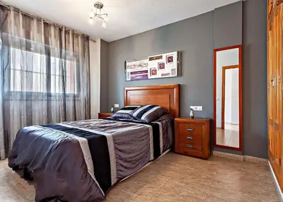 Cama o camas de una habitación en Mar Brasilia Apartamento