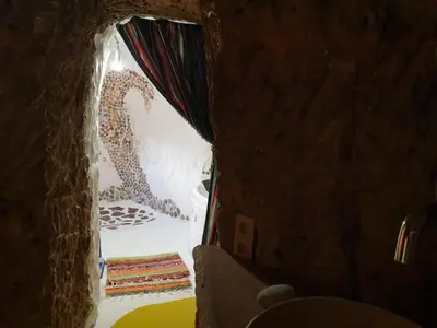Cama o camas de una habitación en Creatively designed CaveHouse with jacuzzi