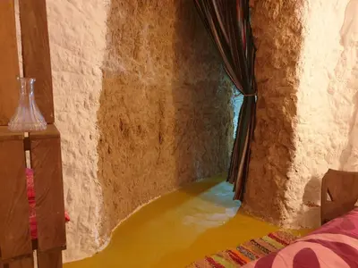 Cama o camas de una habitación en Creatively designed CaveHouse with jacuzzi