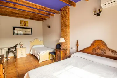 Cama o camas de una habitación en Hostal Rural Turre