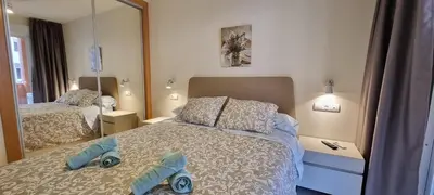 Cama o camas de una habitación en Homes of Spain, Apartamentos Paraiso de Vera Playa, Ed Tahiti bajo F a pie de la playa, vistas piscina