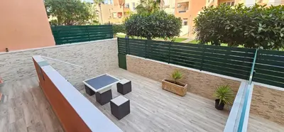 Un balcón o terraza de Homes of Spain, Apartamentos Paraiso de Vera Playa, Ed Tahiti, bajo G a pie de la playa, vistas piscina