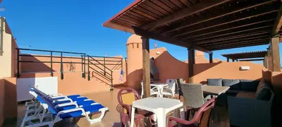 Un balcón o terraza de Homes of Spain, Apartamentos Paraiso Vera Playa, Ed Tahiti, Atico F de 2 dormitorios con piscina privada en solárium y barbacoa, pie de playa