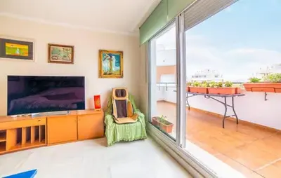 Una televisión o centro de entretenimiento en GOLF, PISCINA,PLAYA
