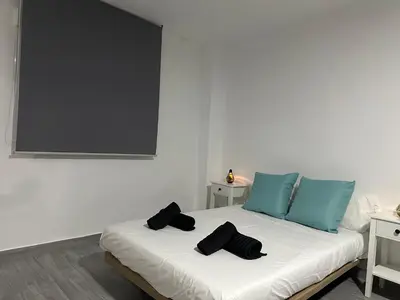 Cama o camas de una habitación en Estadio playa