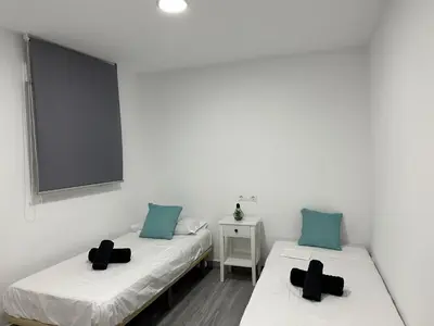 Cama o camas de una habitación en Estadio playa