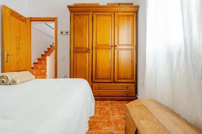 Cama o camas de una habitación en Alzeina, casa con mucho encanto a 300mtr de la playa