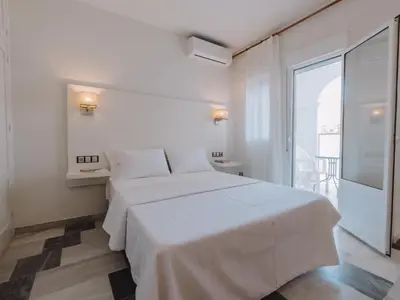 Cama o camas de una habitación en Hostal Las Gaviotas del Cabo