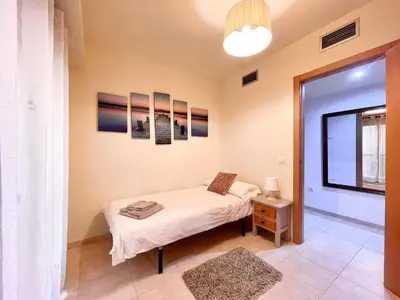 Cama o camas de una habitación en Apartment near beach with pools and hot tub