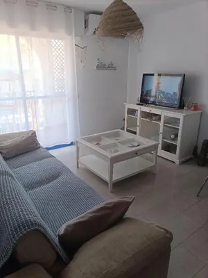 Una televisión o centro de entretenimiento en Tu casita en San José con acceso directo a playa