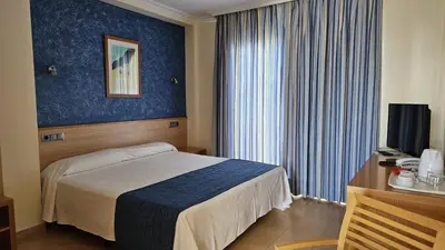 Cama o camas de una habitación en Hotel Punta del Cantal