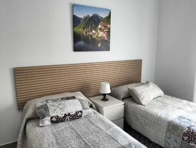 Cama o camas de una habitación en Alojamiento Dunas centro