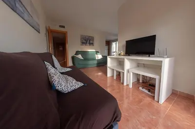 Una televisión o centro de entretenimiento en Apartamento en Vera Playa - Primera línea - Vistas al mar