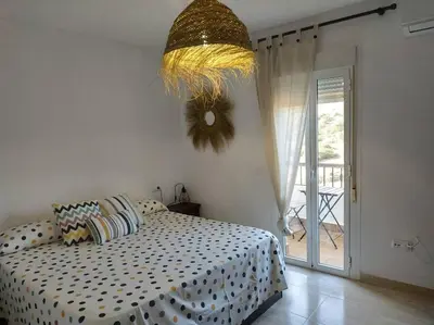 Cama o camas de una habitación en Acogedor duplex para parejas en La Isleta