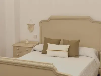 Cama o camas de una habitación en El Nido Alojamiento Turístico