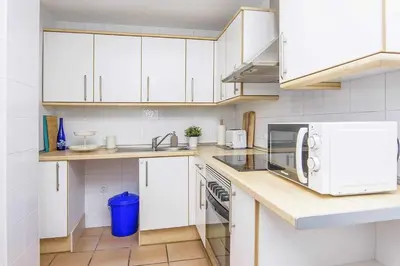 Una cocina o zona de cocina en Las Marinicas -Primera línea de la playa-