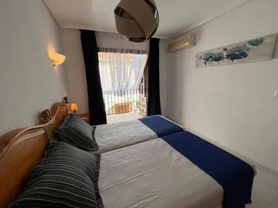 Cama o camas de una habitación en Apartamentos de Flores - Azul