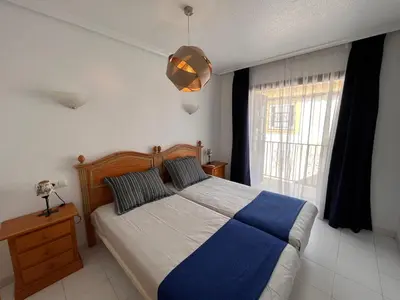 Cama o camas de una habitación en Apartamentos de Flores - Azul
