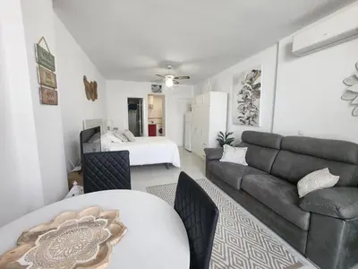 Zona de estar de Estudio en Urbanización naturista con piscina junto al mar