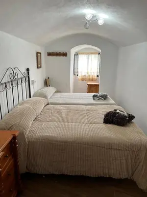 Cama o camas de una habitación en la cueva de guadix