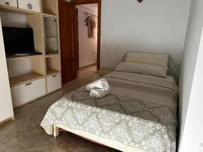 Cama o camas de una habitación en Habitaciones a 10 minutos de la playa de Aguadulce