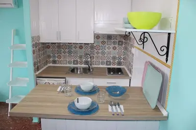 Una cocina o zona de cocina en apartamento vista al mar piscina playa 3 min