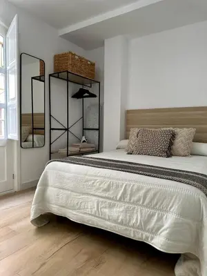 Cama o camas de una habitación en Apartamentos La Hormiga Deluxe