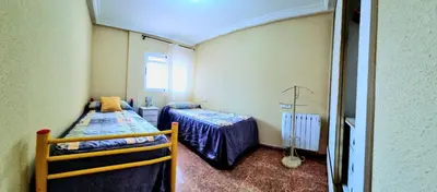 Cama o camas de una habitación en La Aldea bajo dos dormitorios en Puerto Rey