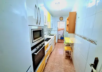Una cocina o zona de cocina en La Aldea bajo dos dormitorios en Puerto Rey
