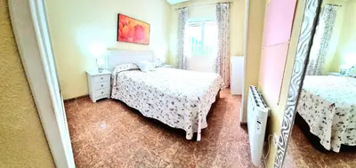 Cama o camas de una habitación en La Aldea bajo dos dormitorios en Puerto Rey