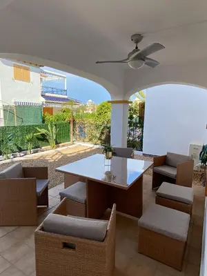 Zona de estar de Acogedor apartamento en la playa vera