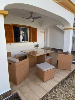 Zona de estar de Acogedor apartamento en la playa vera