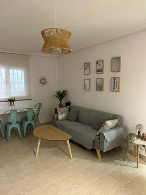 Zona de estar de Acogedor apartamento en la playa vera