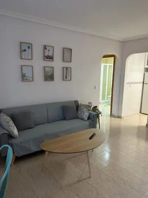 Zona de estar de Acogedor apartamento en la playa vera