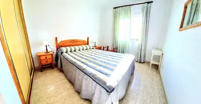 Cama o camas de una habitación en Dúplex 3 Dormitorios VERAMAR 5 Vera Playa primera línea de playa con vistas al mar