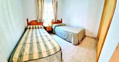 Cama o camas de una habitación en Dúplex 3 Dormitorios VERAMAR 5 Vera Playa primera línea de playa con vistas al mar