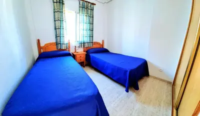 Cama o camas de una habitación en Dúplex 3 Dormitorios VERAMAR 5 Vera Playa primera línea de playa con vistas al mar